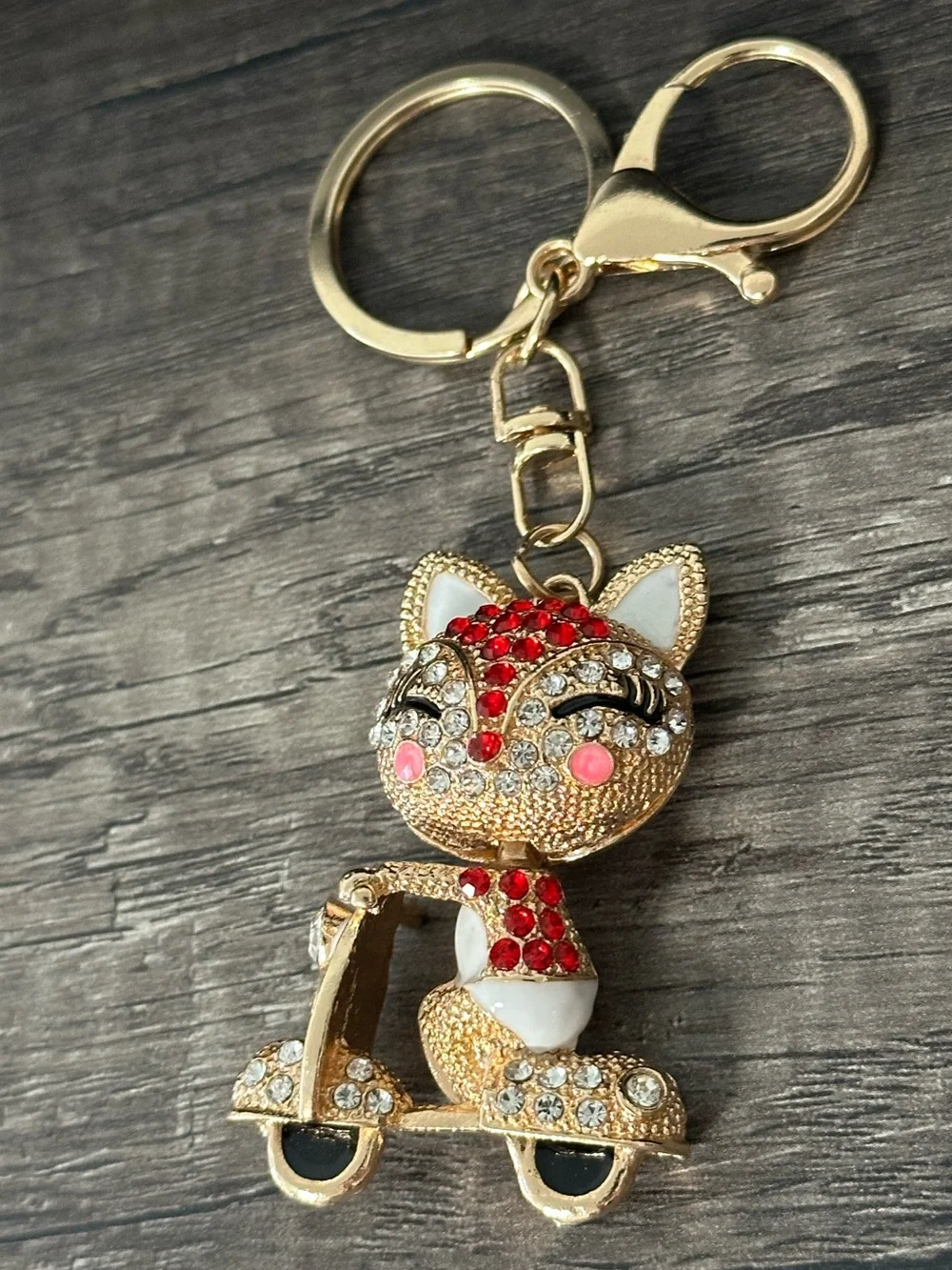 Gold Toned Cat Keychain Charm with Red and Pink Accents